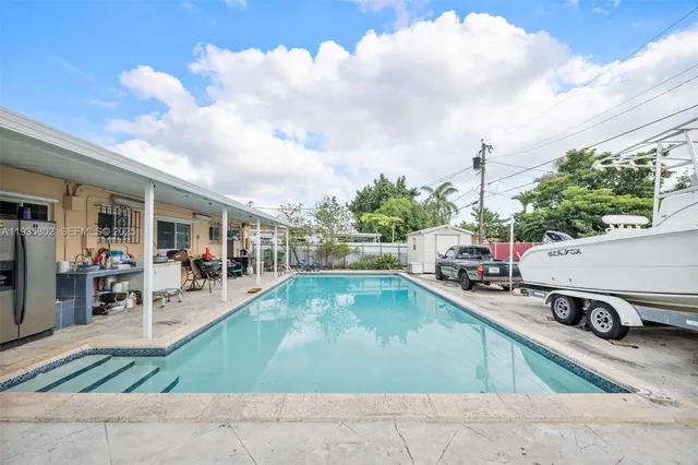 a view of a backyard with sitting area