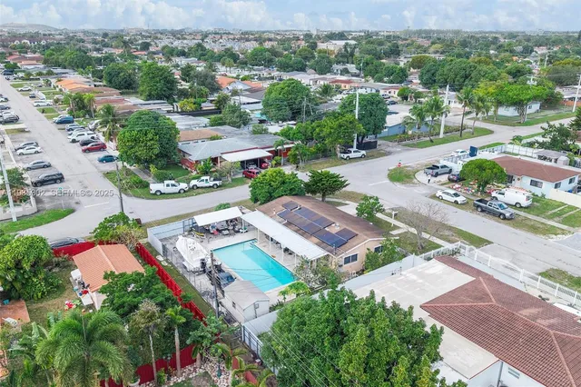 an aerial view of a house with a garden