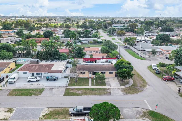 an aerial view of a house with a garden