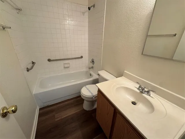 an empty room with a ceiling fan and a window