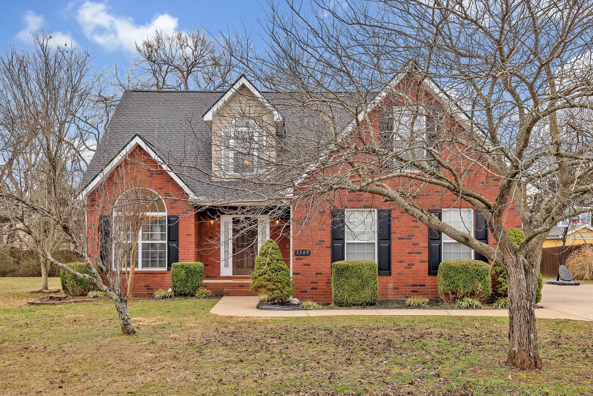 3309 Cornerstone Drive Murfreesboro, TN 37128 - Photo 1 of 43 a front view of a house with garden
