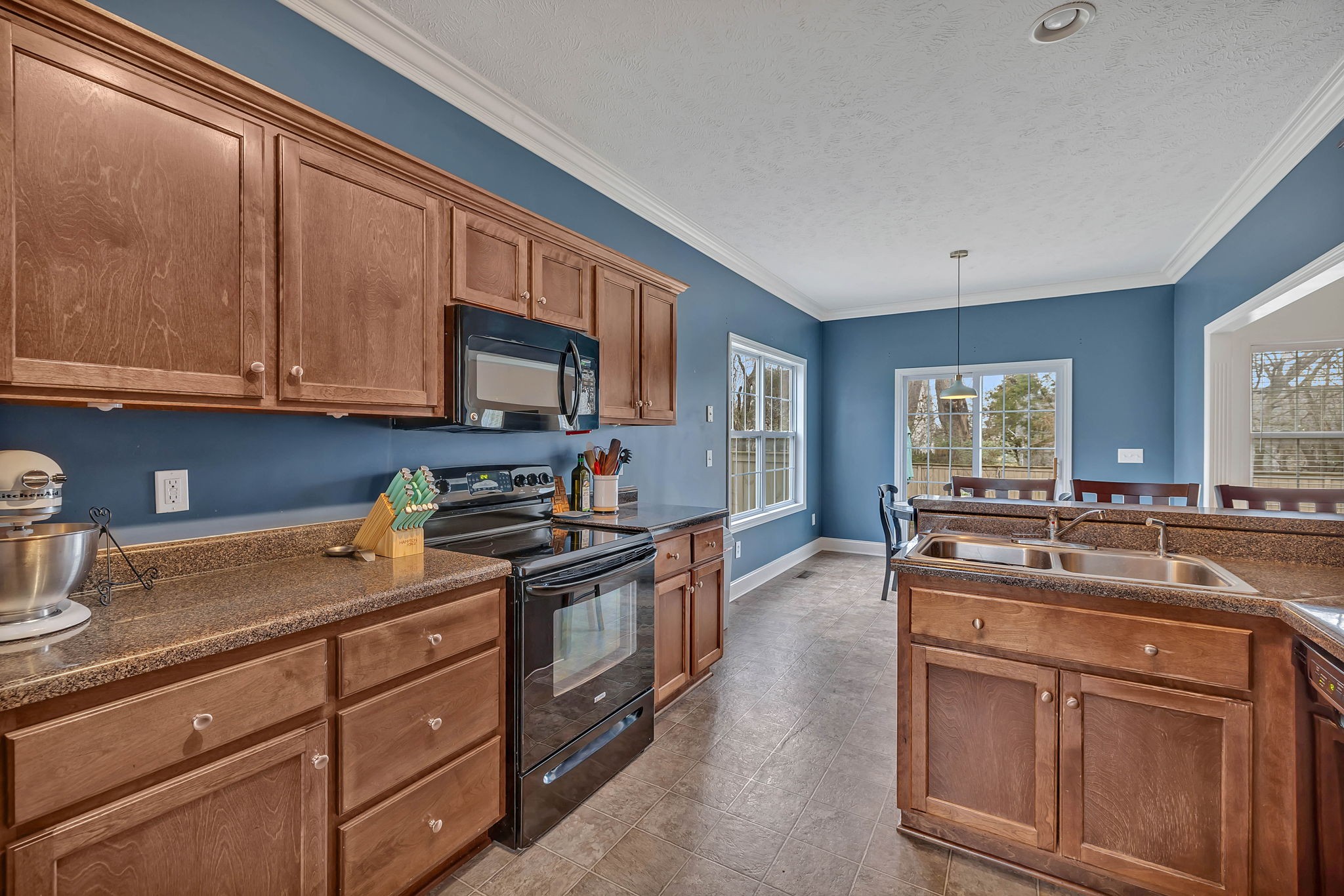 3309 Cornerstone Drive Murfreesboro, TN 37128 - Photo 11 of 43 a kitchen with stainless steel appliances granite countertop a sink stove and cabinets