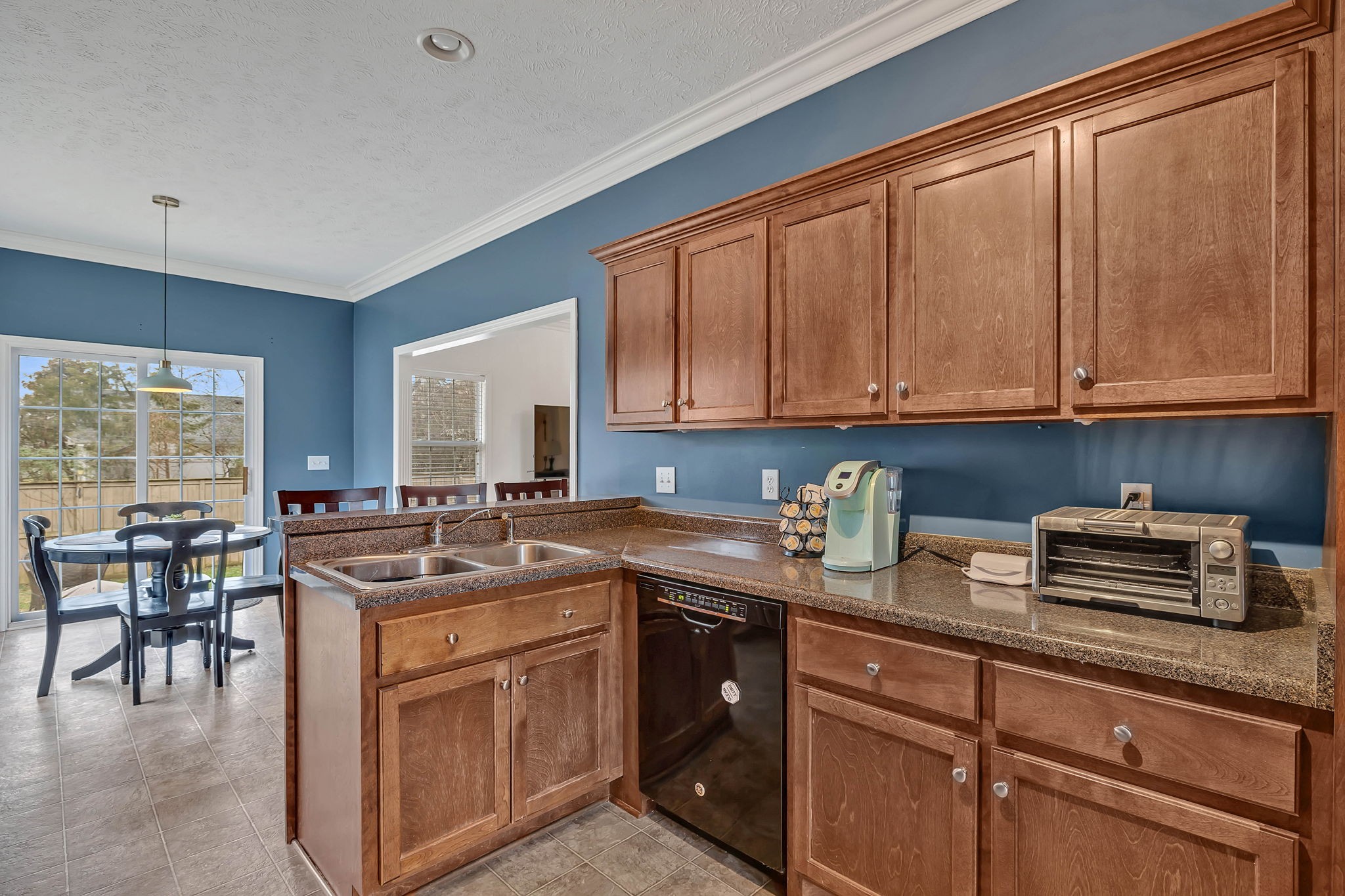 3309 Cornerstone Drive Murfreesboro, TN 37128 - Photo 12 of 43 a kitchen with stainless steel appliances granite countertop a stove a sink and a microwave