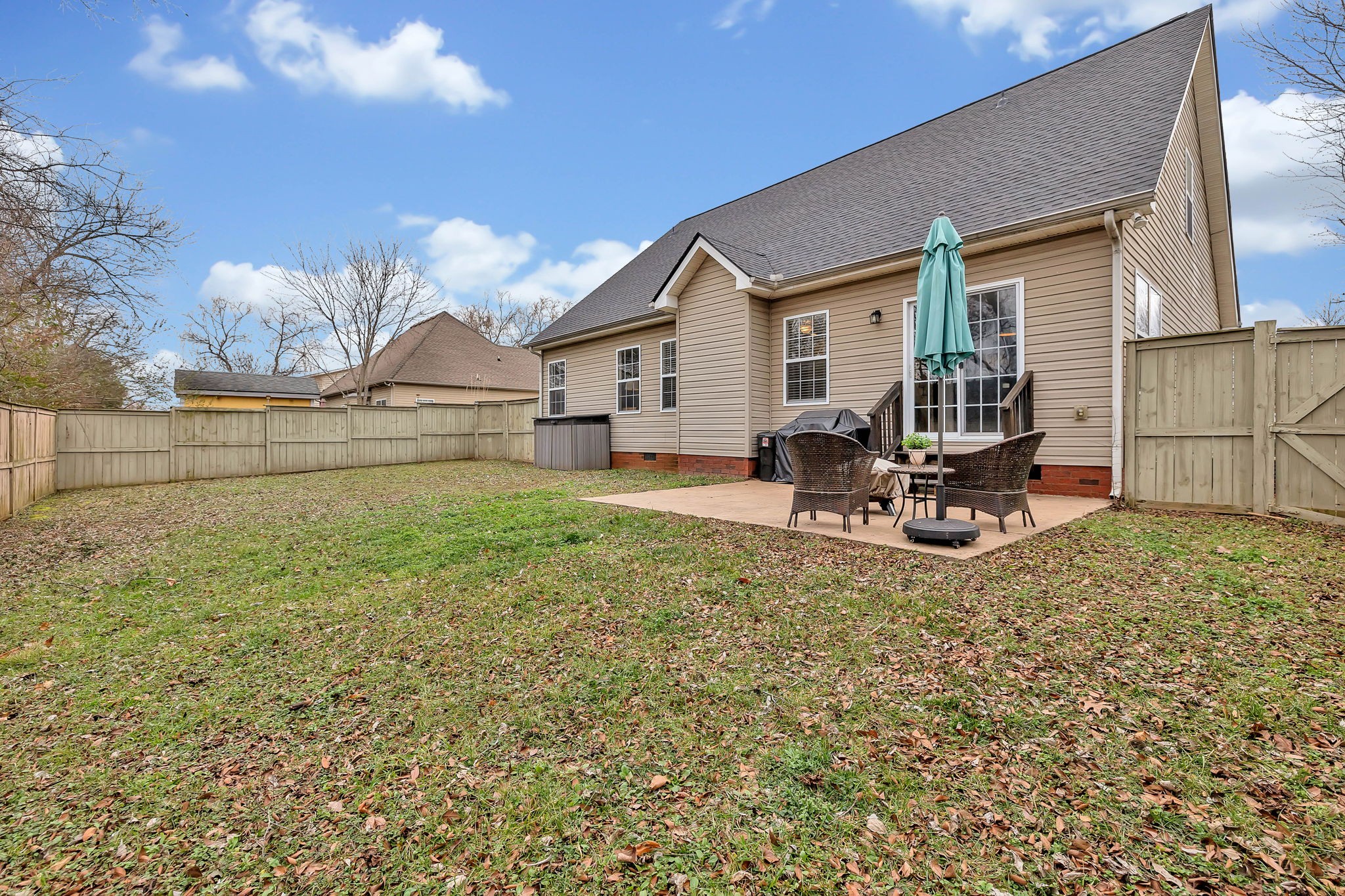 3309 Cornerstone Drive Murfreesboro, TN 37128 - Photo 41 of 43 a backyard of a house with table and chairs