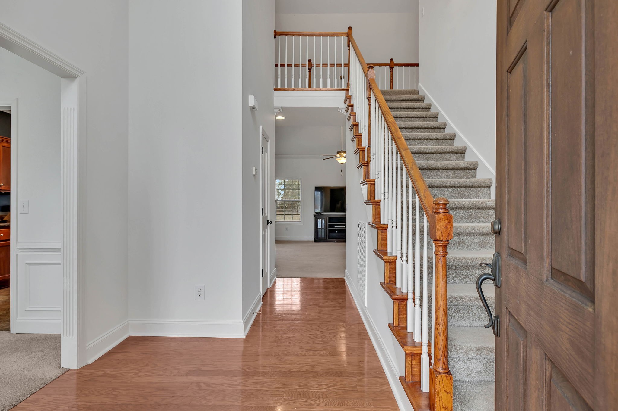 3309 Cornerstone Drive Murfreesboro, TN 37128 - Photo 5 of 43 a view of a hallway with wooden floor and staircase
