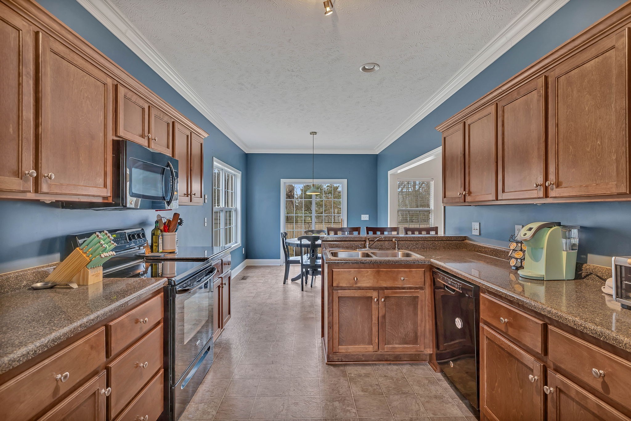 3309 Cornerstone Drive Murfreesboro, TN 37128 - Photo 9 of 43 a kitchen with a sink stove and cabinets