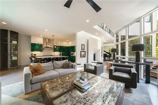a bathroom with a granite countertop sink a mirror and a shower