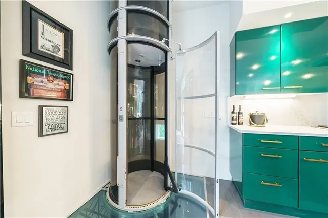 a view of a living room a flat screen tv and a fireplace