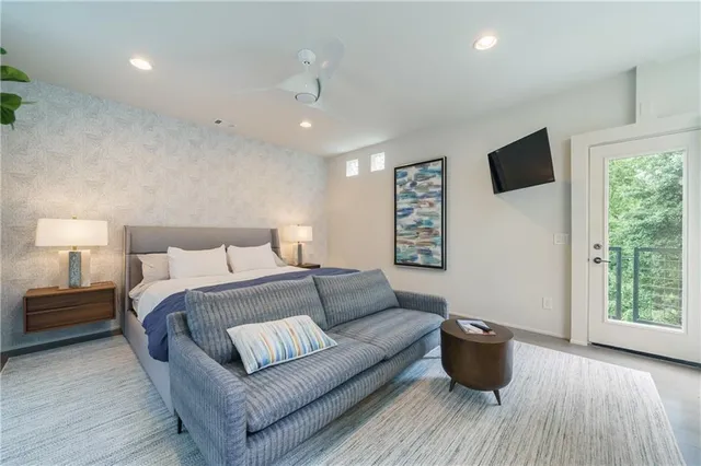 an aerial view of a house with swimming pool and garden