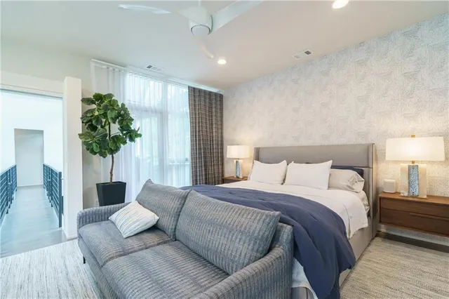 a view of backyard with swimming pool and outdoor seating