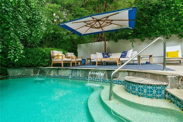 a view of a kitchen with a sink and a fireplace