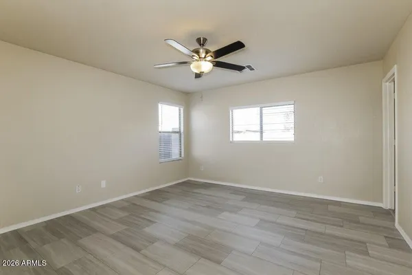 a view of an empty room with a window