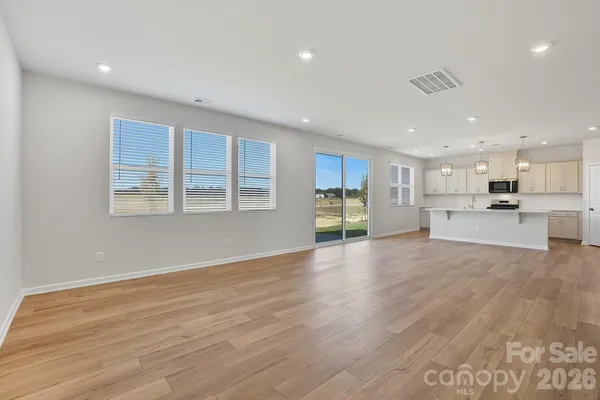 a view of kitchen and wooden floor