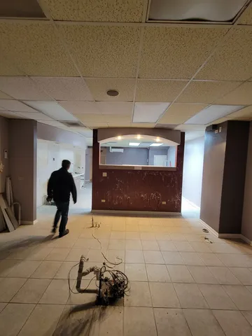 a view of a livingroom and a fireplace