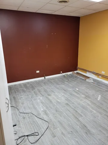 a white toilet sitting next to a white sink and a small white toilet