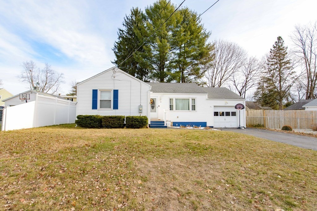 99 Merrill Road Springfield, MA 01119 - Photo 1 of 30 a front view of a house with a yard and garage