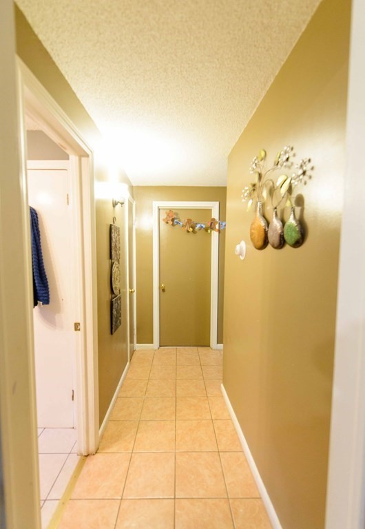 99 Merrill Road Springfield, MA 01119 - Photo 12 of 30 a view of a hallway with wooden floor