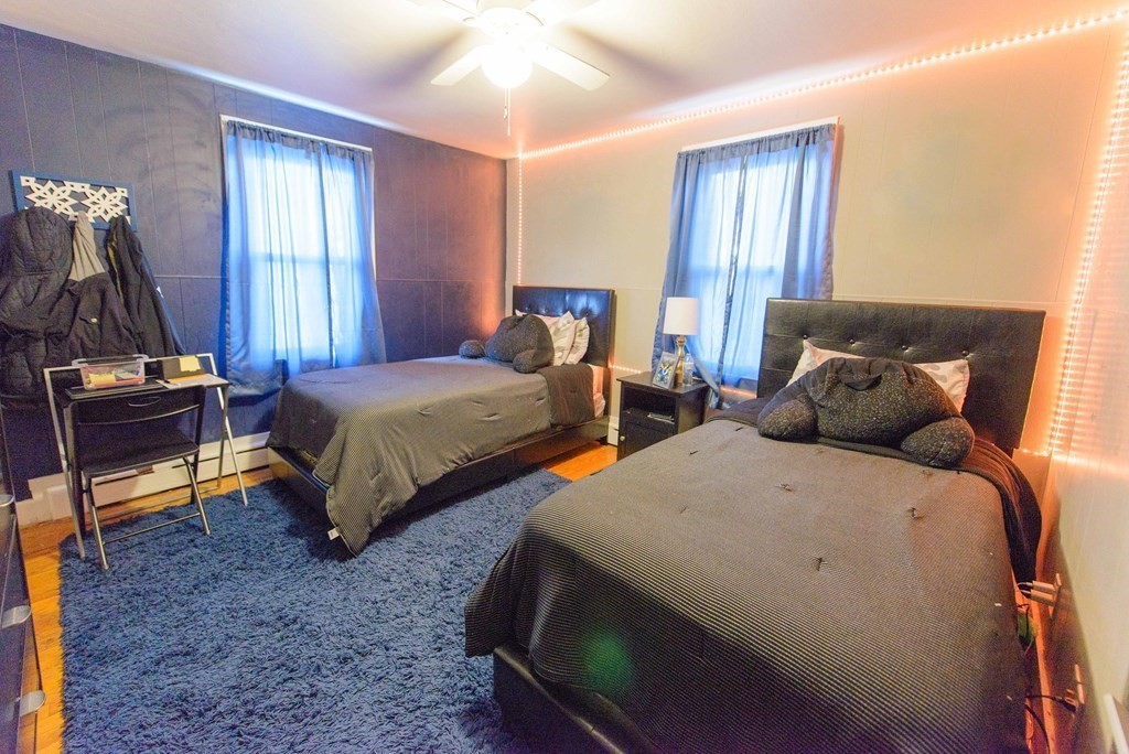 99 Merrill Road Springfield, MA 01119 - Photo 14 of 30 a bedroom with two beds and a chandelier