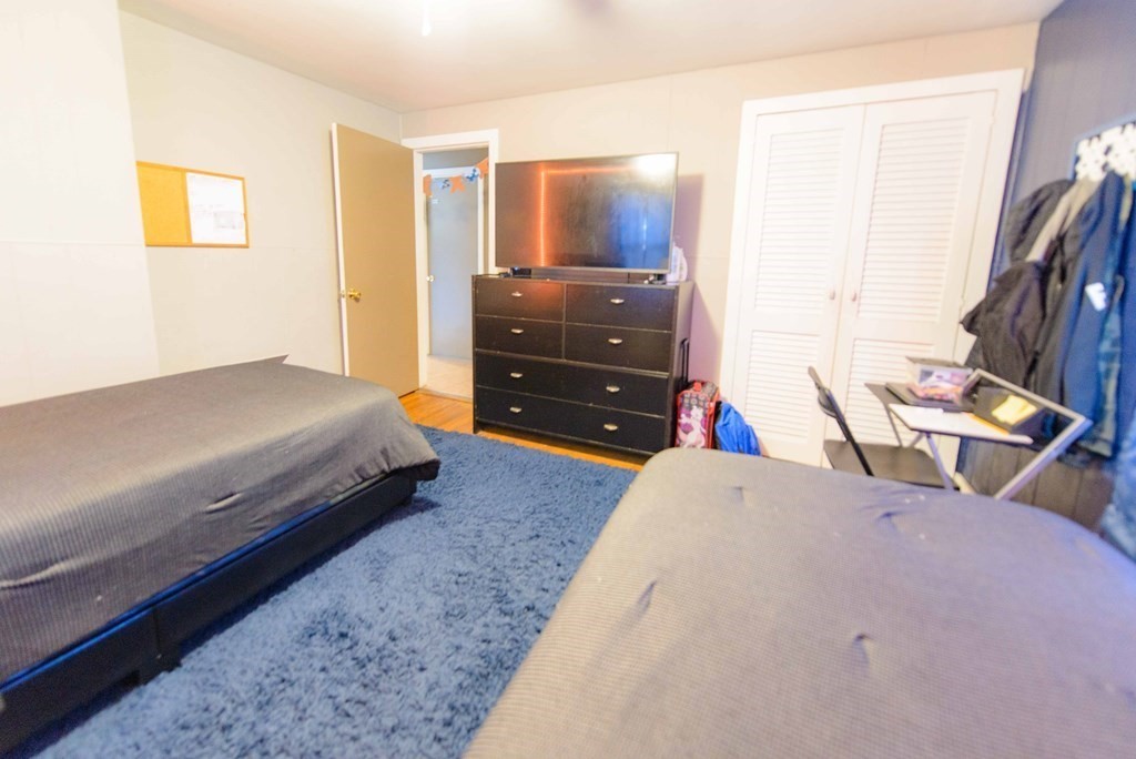 99 Merrill Road Springfield, MA 01119 - Photo 15 of 30 a bedroom with a bed and furniture