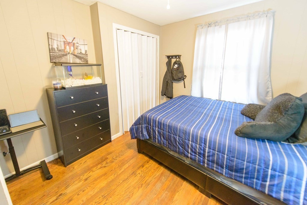 99 Merrill Road Springfield, MA 01119 - Photo 17 of 30 a bedroom with a bed and a window