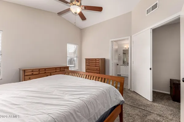 a kitchen with stainless steel appliances granite countertop a refrigerator a sink and a stove