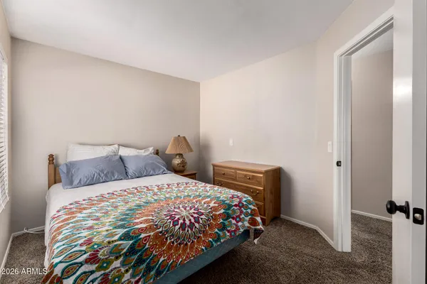 a bedroom with bed and window