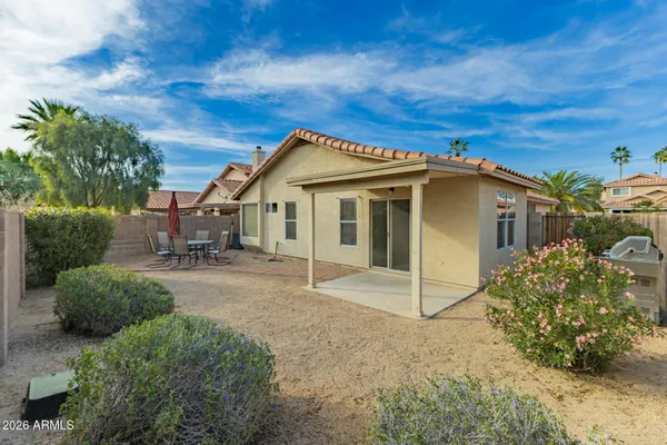 a room with furniture and large windows