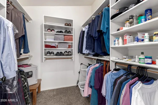 a bathroom with a granite countertop sink a large mirror and a bathtub with shower