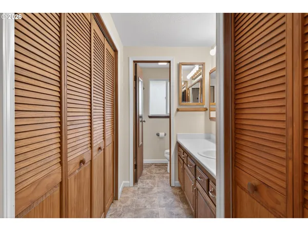 a view of a kitchen from the hallway