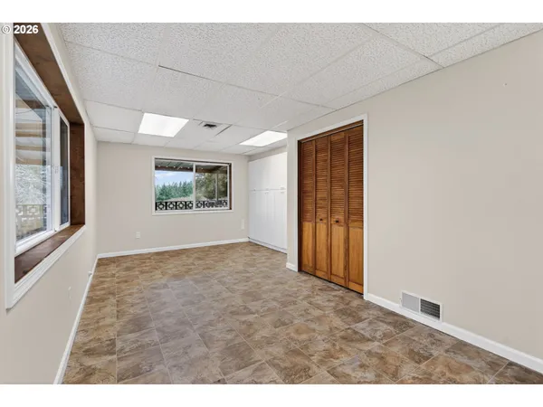 a view of an empty room and window