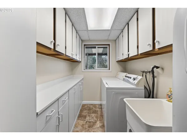 a kitchen with a stove a sink and a refrigerator