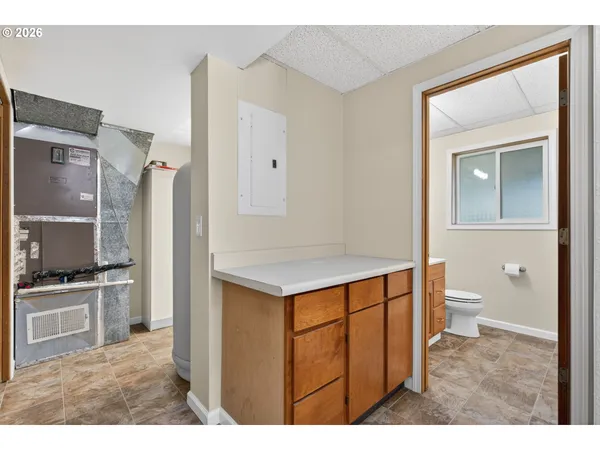 a kitchen with a sink stove and refrigerator