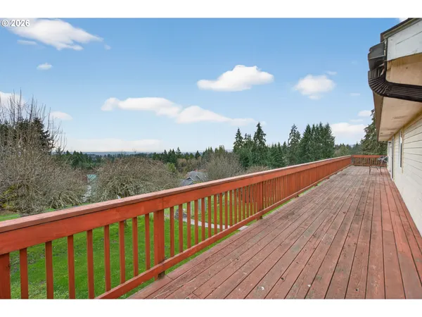 a view of balcony with wooden floor