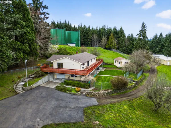 an aerial view of a house with yard swimming pool and outdoor seating