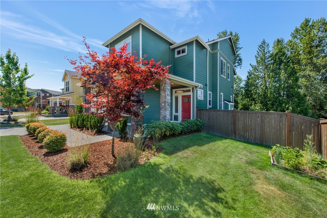 27418 Northeast 152nd Court Duvall, WA 98019 - Photo 2 of 40 a front view of a house with garden