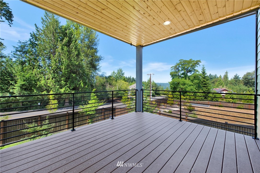 27418 Northeast 152nd Court Duvall, WA 98019 - Photo 12 of 40 a view of a balcony with wooden floor and iron stairs