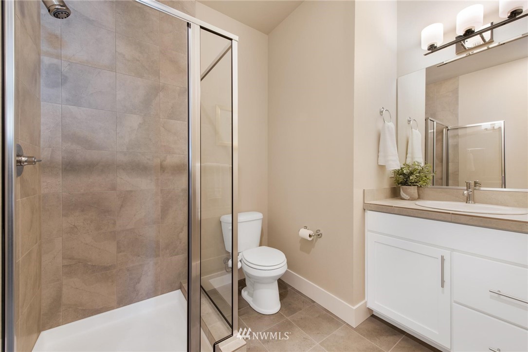 27418 Northeast 152nd Court Duvall, WA 98019 - Photo 16 of 40 a bathroom with a sink a toilet a shower and a mirror