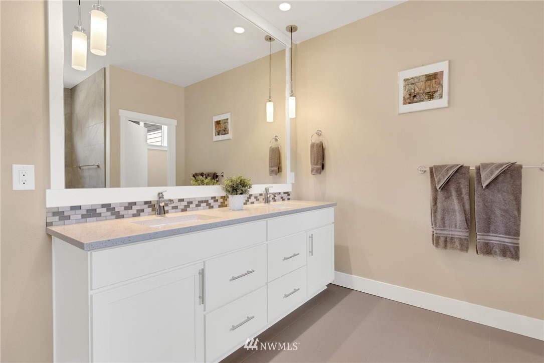 27418 Northeast 152nd Court Duvall, WA 98019 - Photo 19 of 40 a bathroom with a sink and a mirror