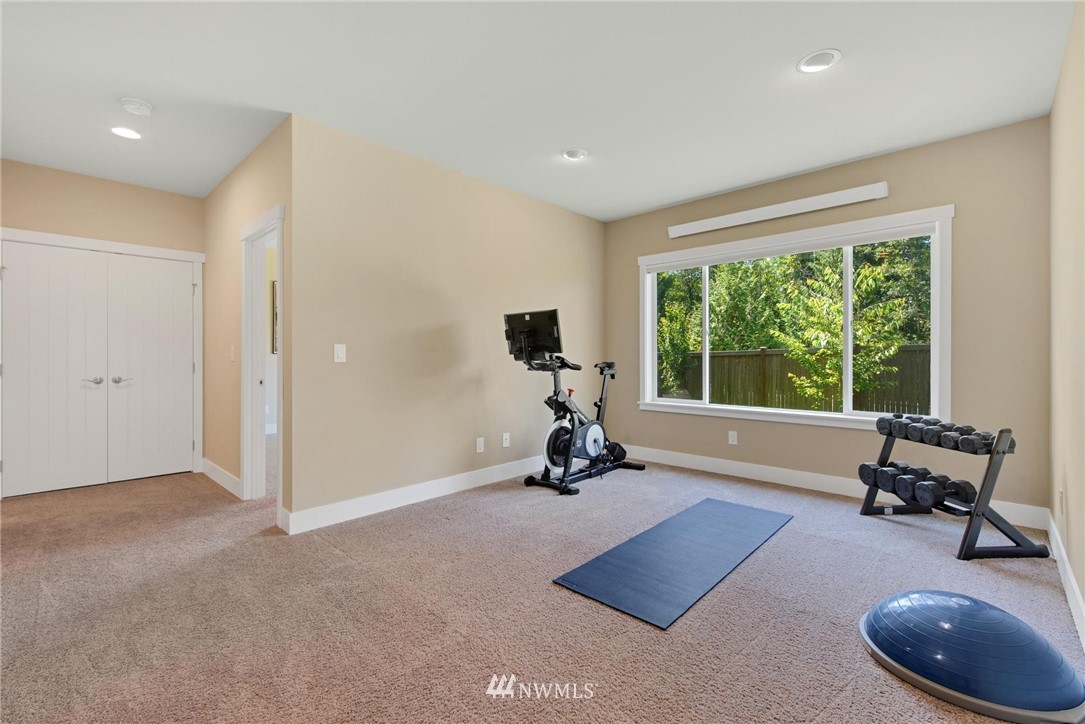 27418 Northeast 152nd Court Duvall, WA 98019 - Photo 29 of 40 a room with gym equipment and a large window