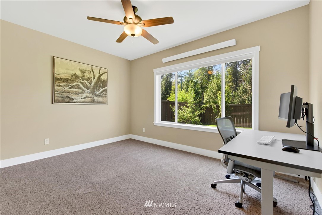 27418 Northeast 152nd Court Duvall, WA 98019 - Photo 30 of 40 a view of a workspace with furniture and a window