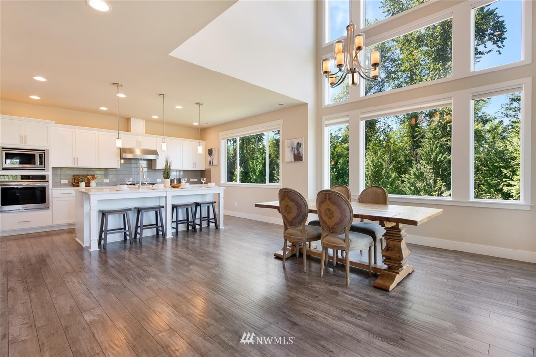 27418 Northeast 152nd Court Duvall, WA 98019 - Photo 7 of 40 a dining room with furniture window and wooden floor