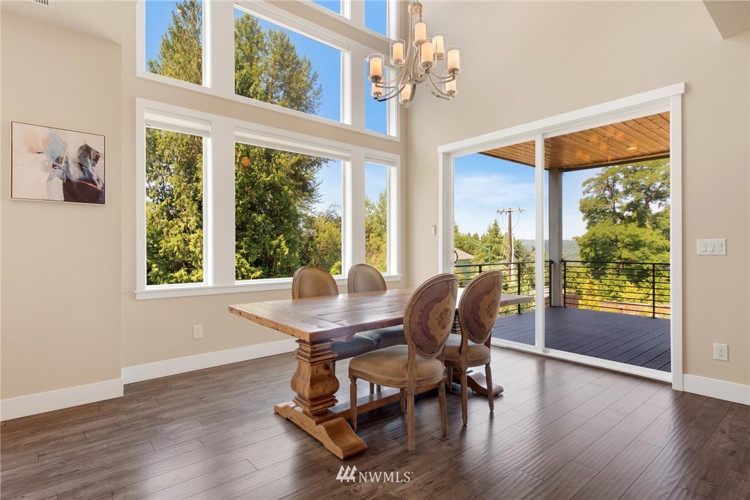 27418 Northeast 152nd Court Duvall, WA 98019 - Photo 8 of 40 a dining room with wooden floor glass table and chairs