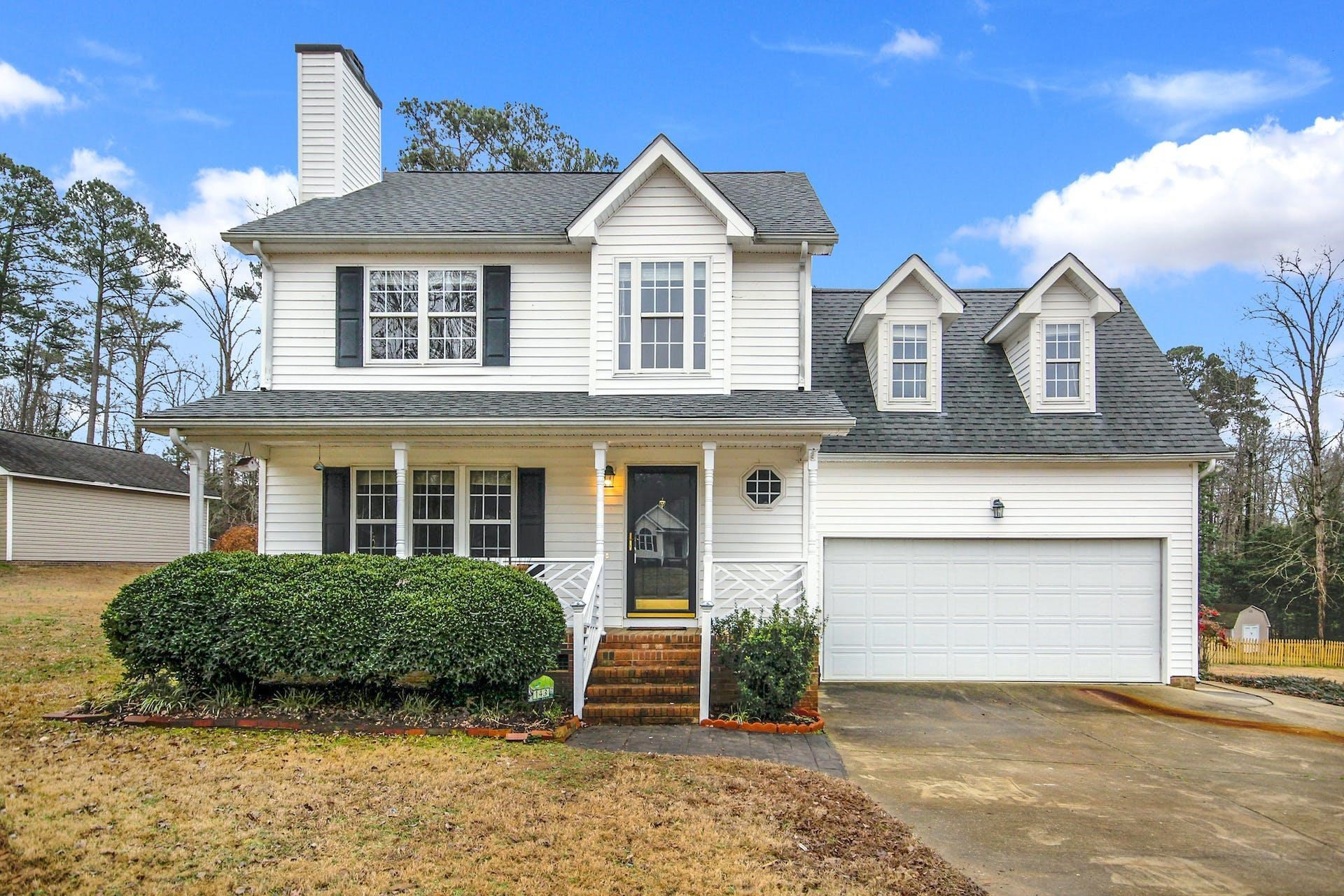 143 Susan Drive Garner, NC 27529 - Photo 1 of 27 a front view of a house with a yard