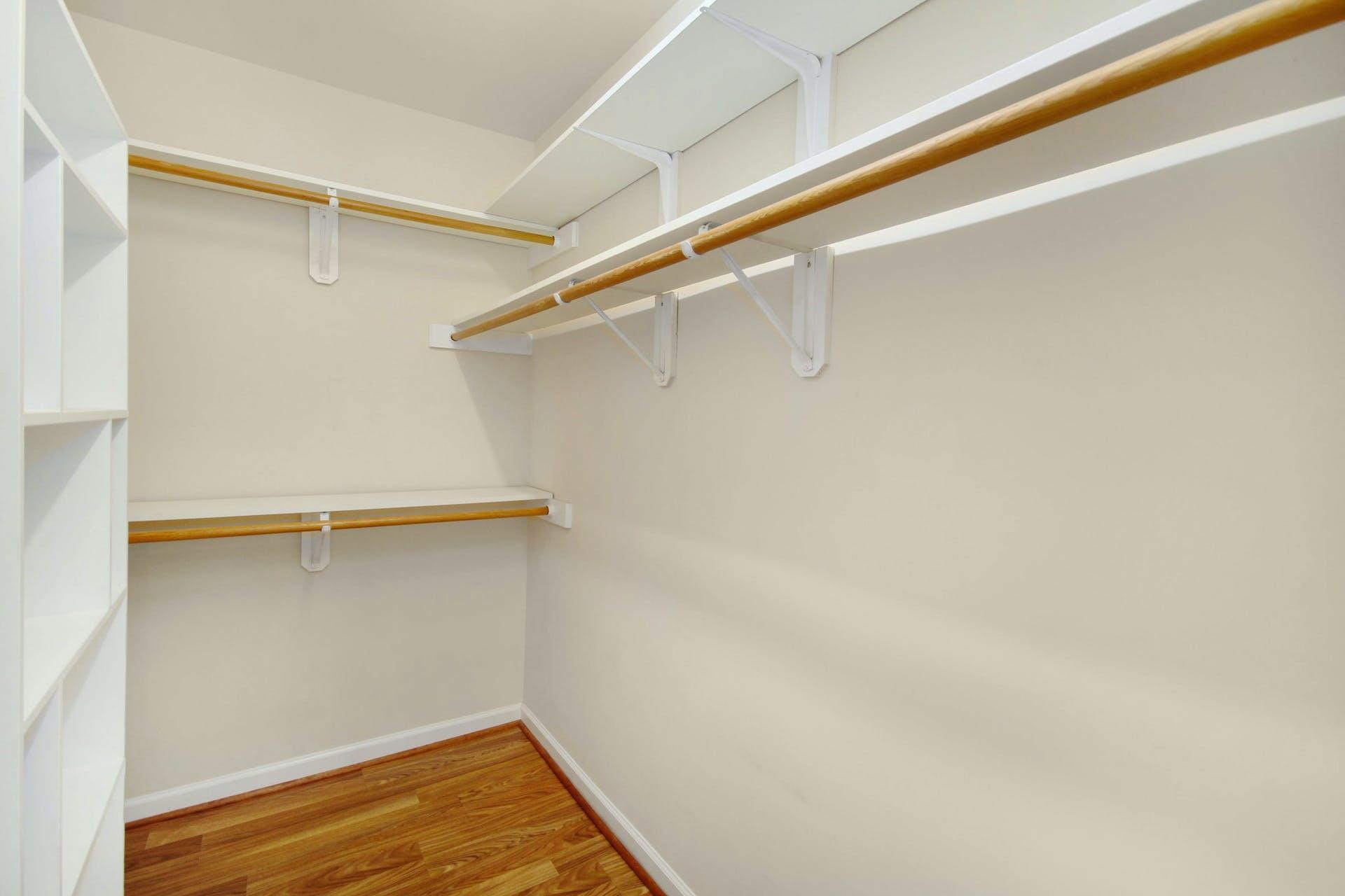 143 Susan Drive Garner, NC 27529 - Photo 18 of 27 a view of walk in closet with empty racks