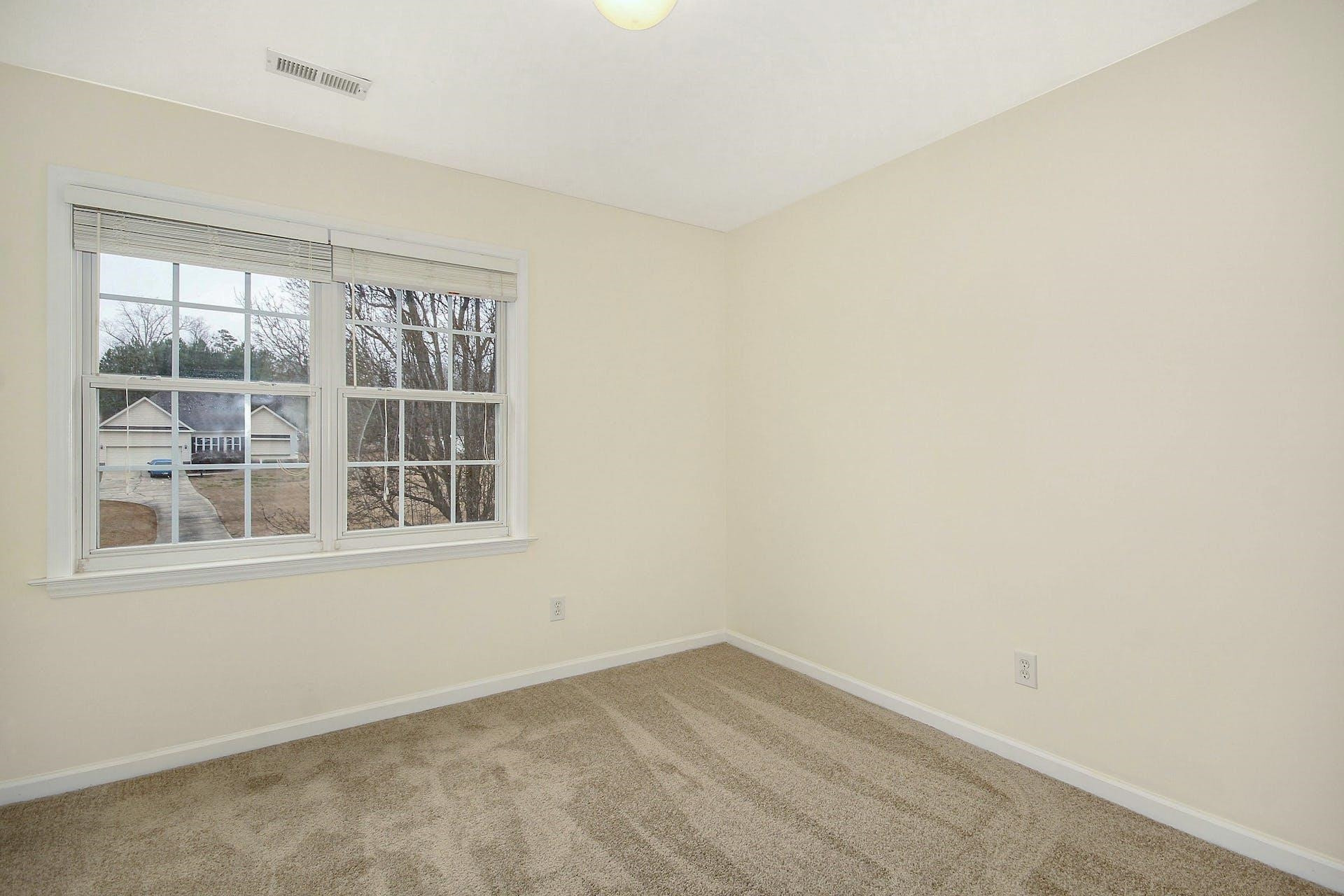 143 Susan Drive Garner, NC 27529 - Photo 19 of 27 an empty room with a window