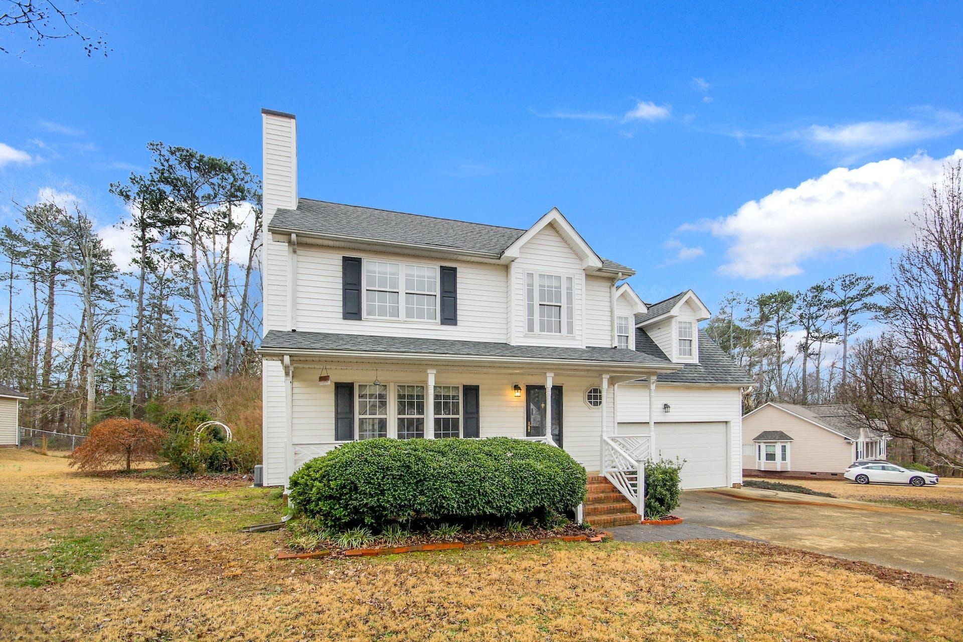 143 Susan Drive Garner, NC 27529 - Photo 2 of 27 a front view of a house with garden