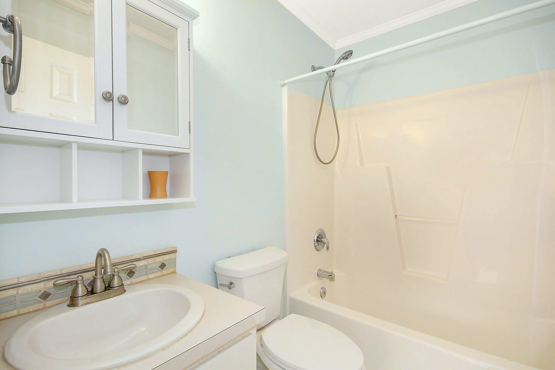 143 Susan Drive Garner, NC 27529 - Photo 23 of 27 a bathroom with a sink toilet and shower