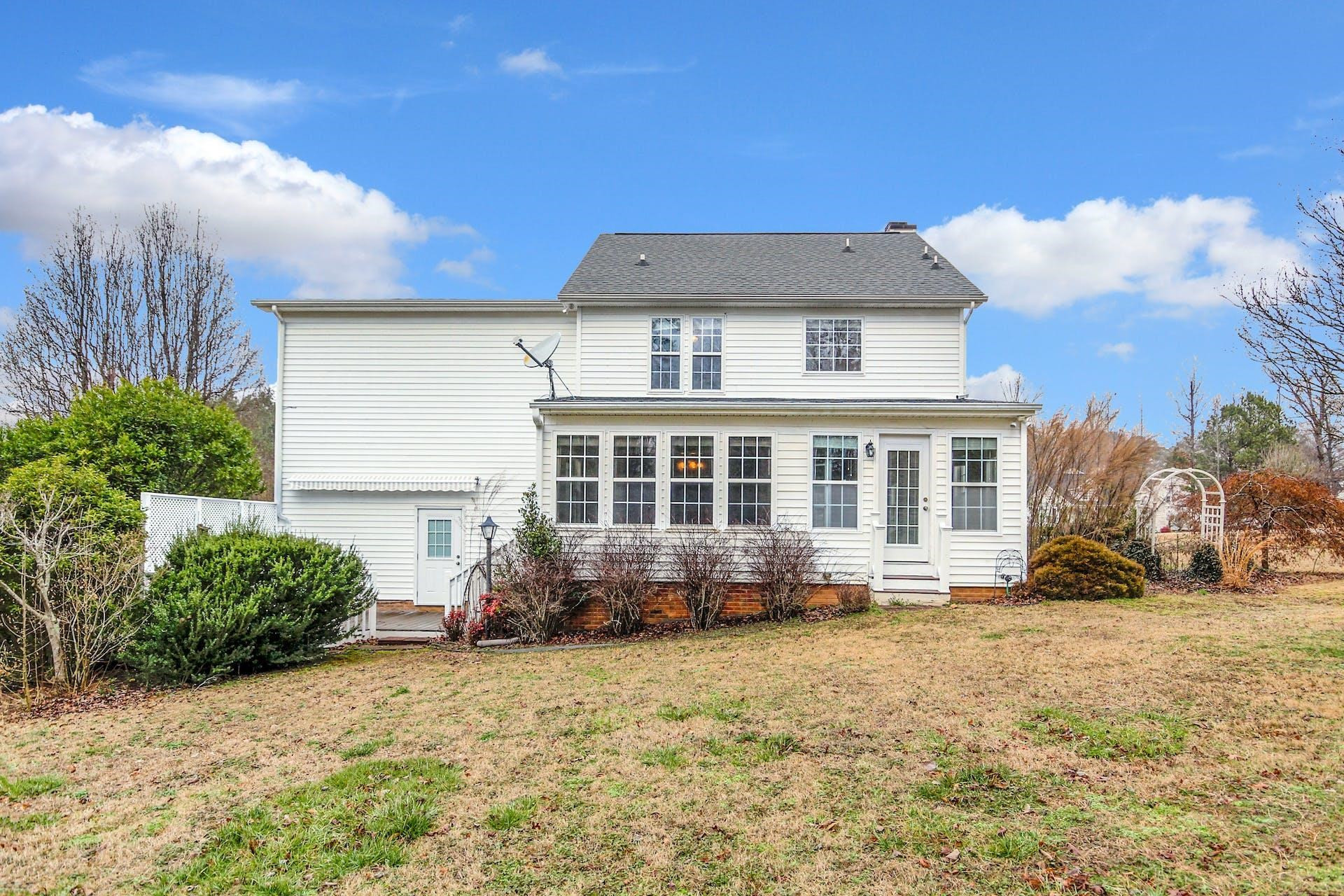 143 Susan Drive Garner, NC 27529 - Photo 25 of 27 a front view of a house with a yard