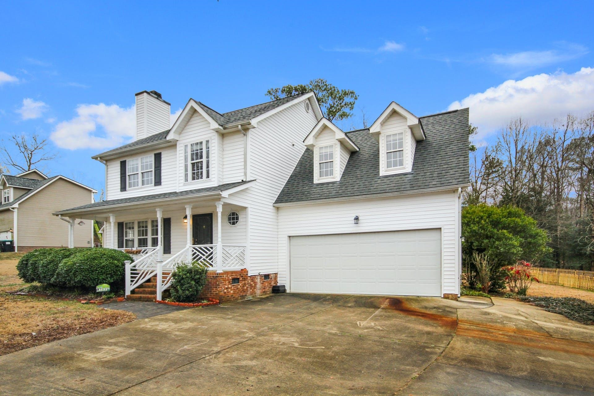143 Susan Drive Garner, NC 27529 - Photo 3 of 27 a view of a house with a yard and garage