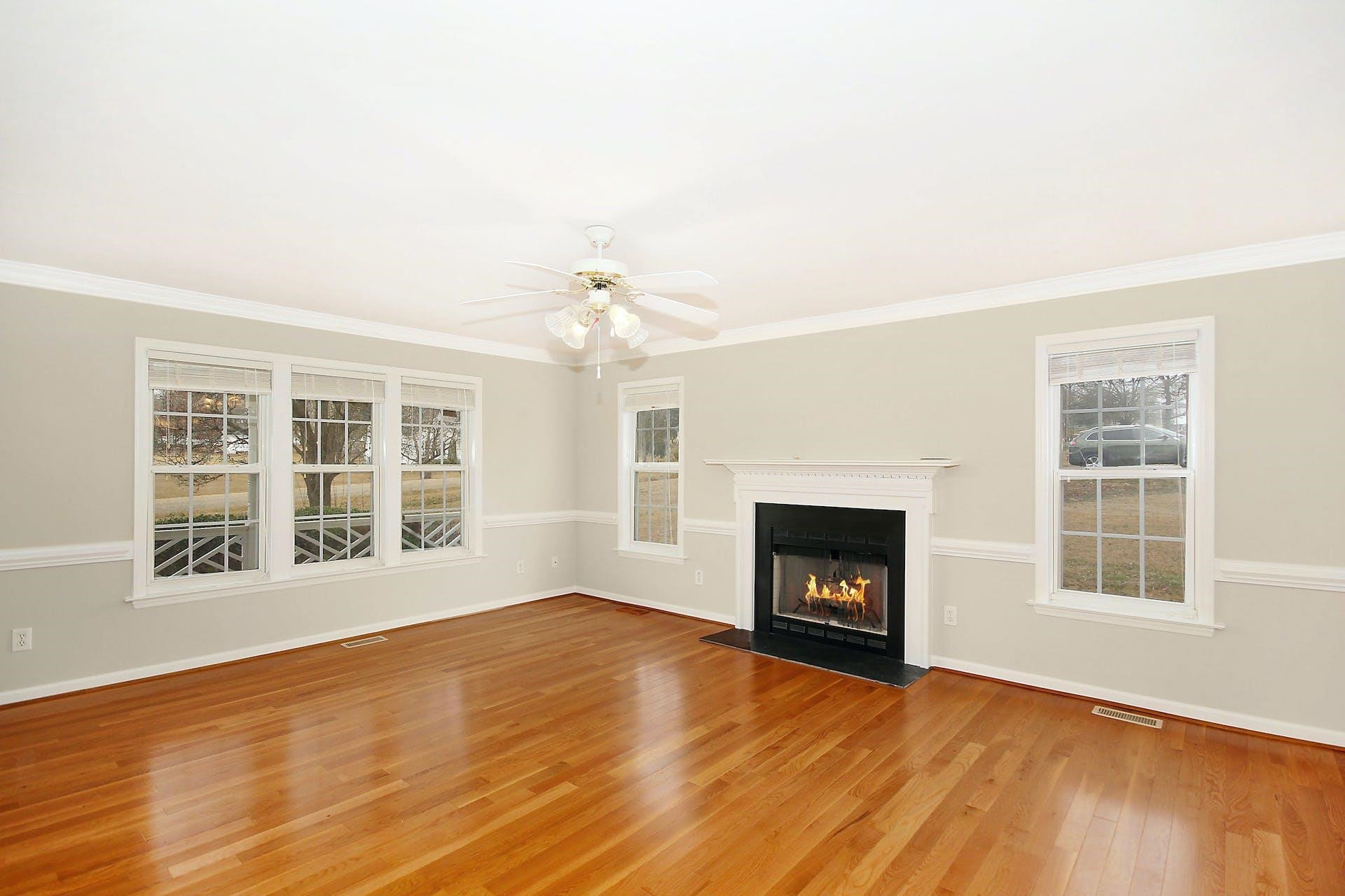 143 Susan Drive Garner, NC 27529 - Photo 5 of 27 a view of an empty room with wooden floor and a window